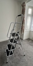 Folding ladders with handrail